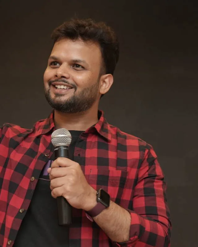 Samir Dash speaking on stage